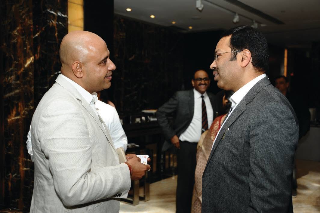 Sameer Sikka in conversation at a professional event